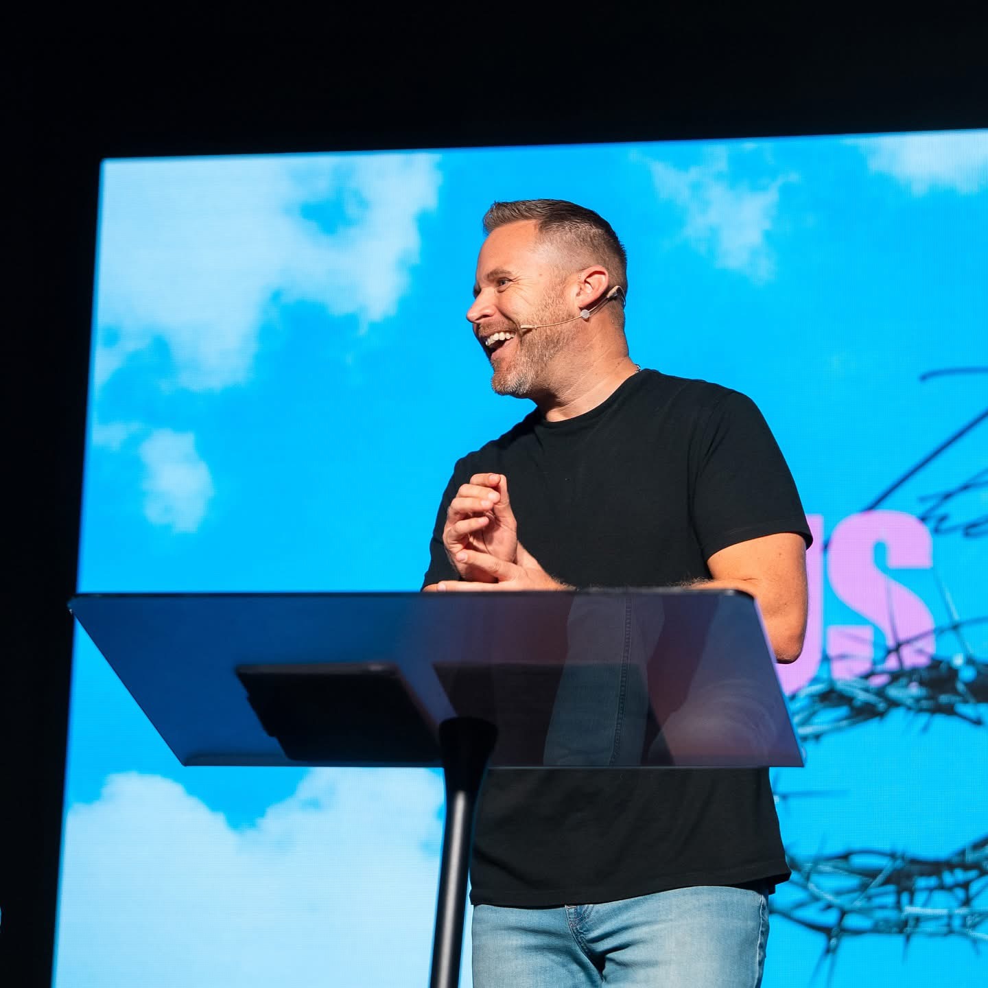 Jason Parks laughing while speaking on stage